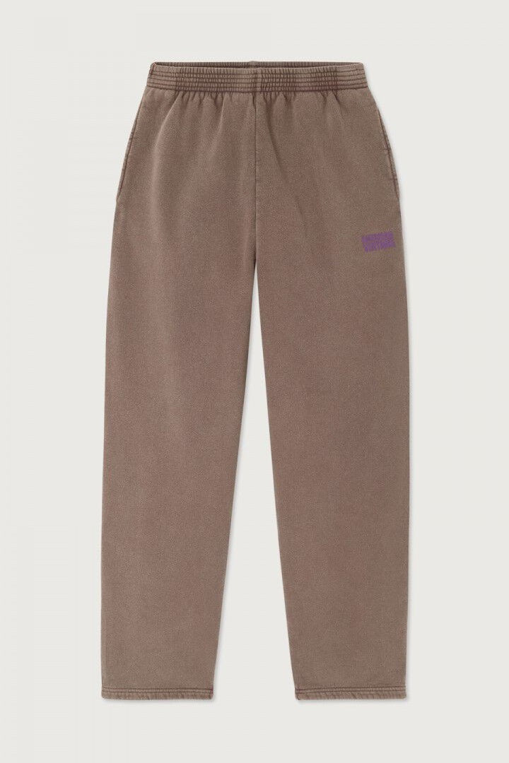 Brown sweatpants with a small American Vintage logo on a light gray background