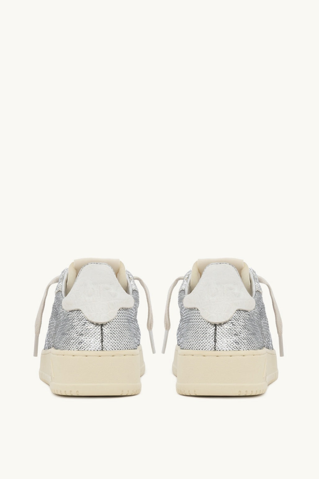 Pair of Autry Dallas silver sneakers on a white background