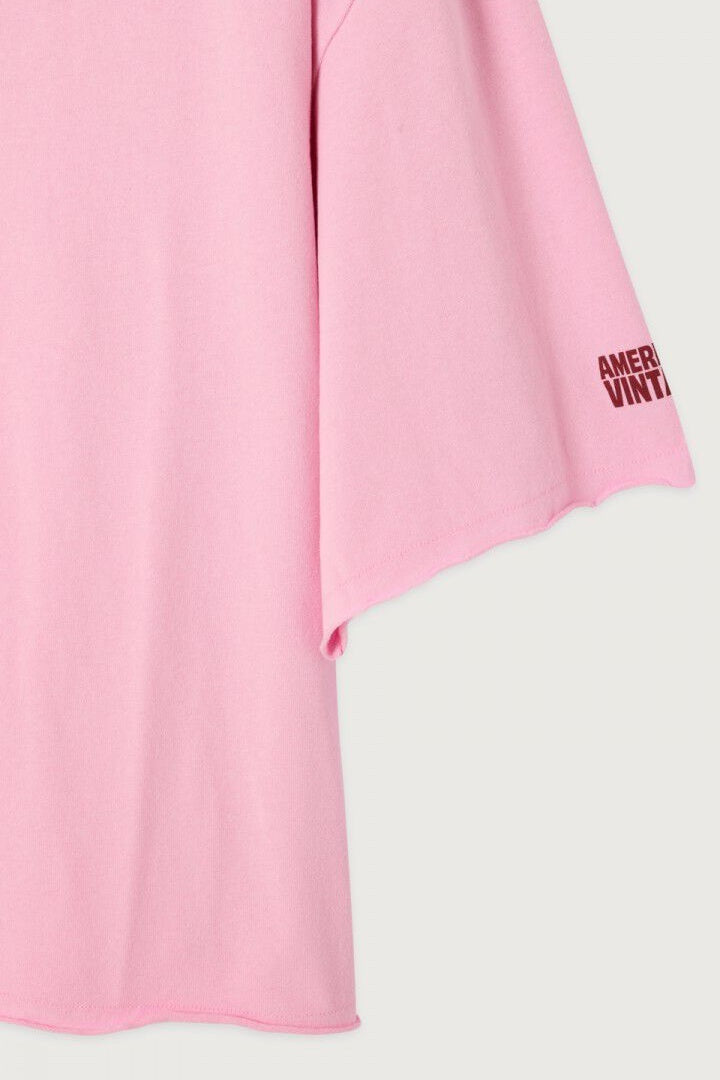 Pink and white garment with 'American Vintage' branding on a light gray background