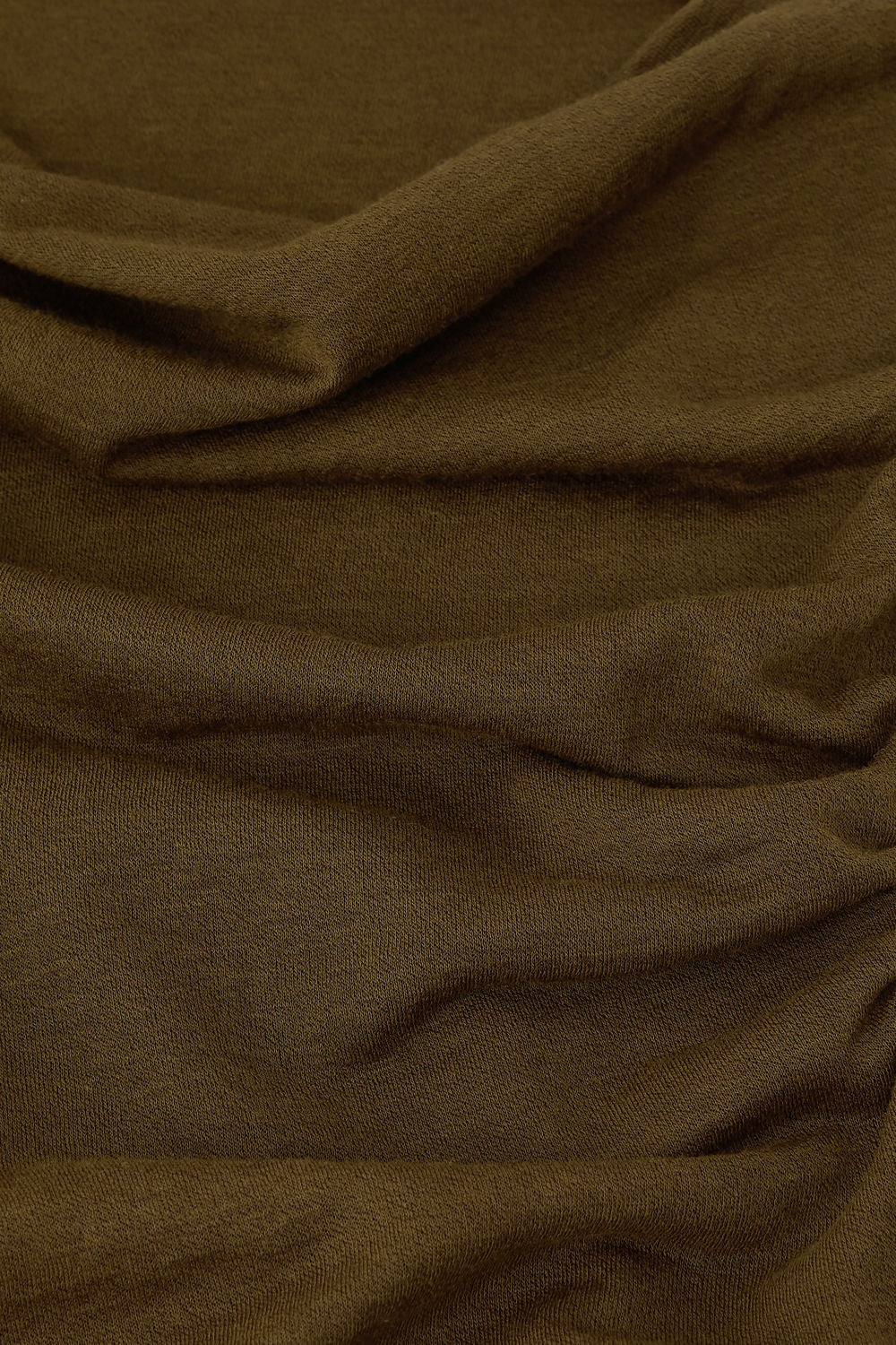 Close-up of bronze fabric with folds