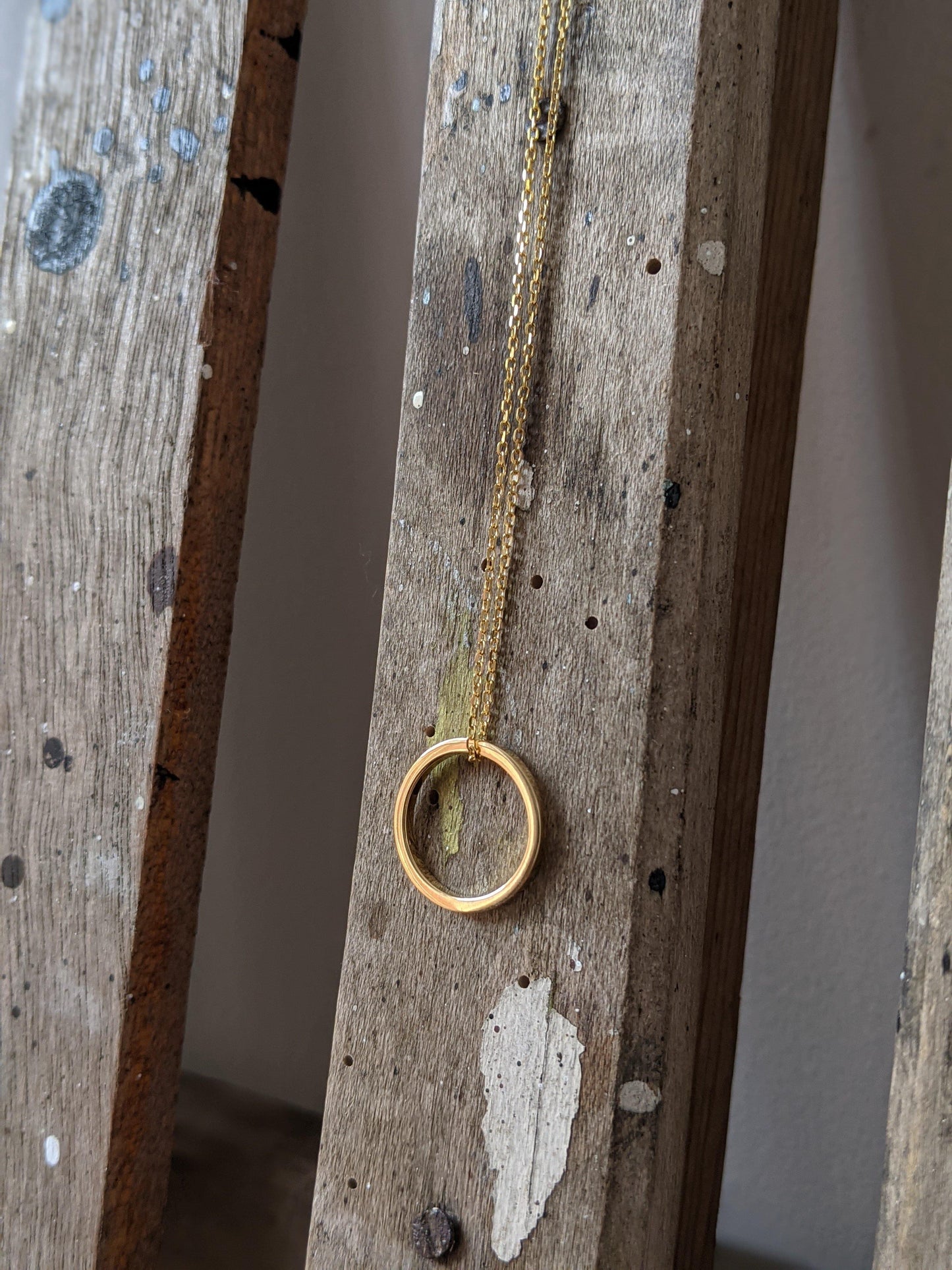 tilly sveaas small gold eternity ring on trace chain necklace