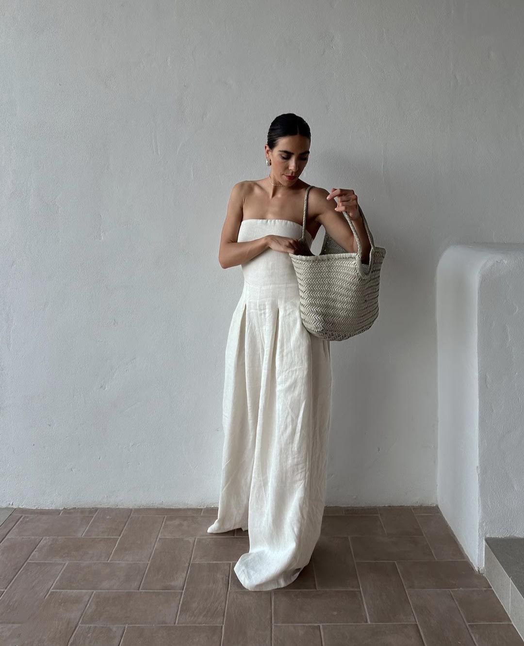 Woman wearing the Dragon Diffusion White woven leather bag