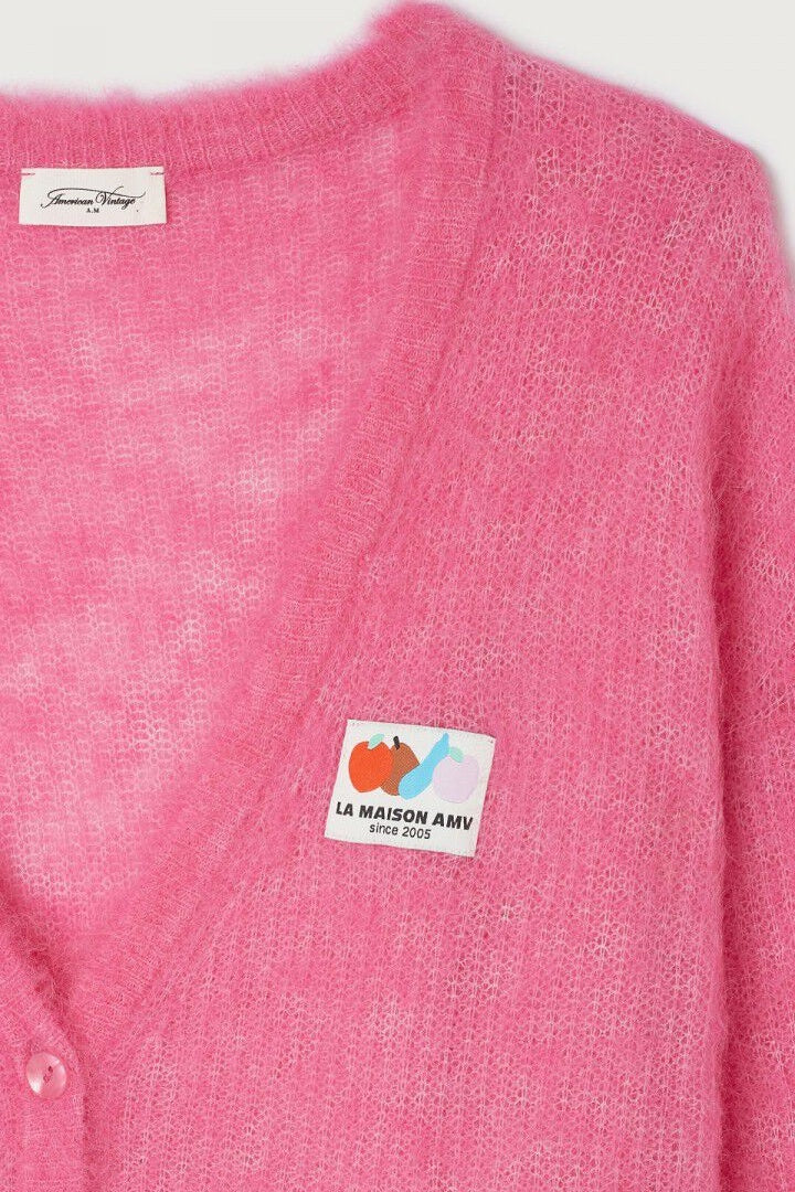 close up of branding detail on cardigan