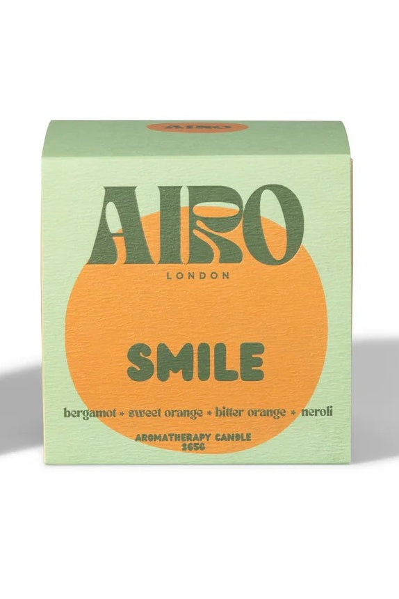 Airo London 'Smile' aromatherapy candle packaging on a white background