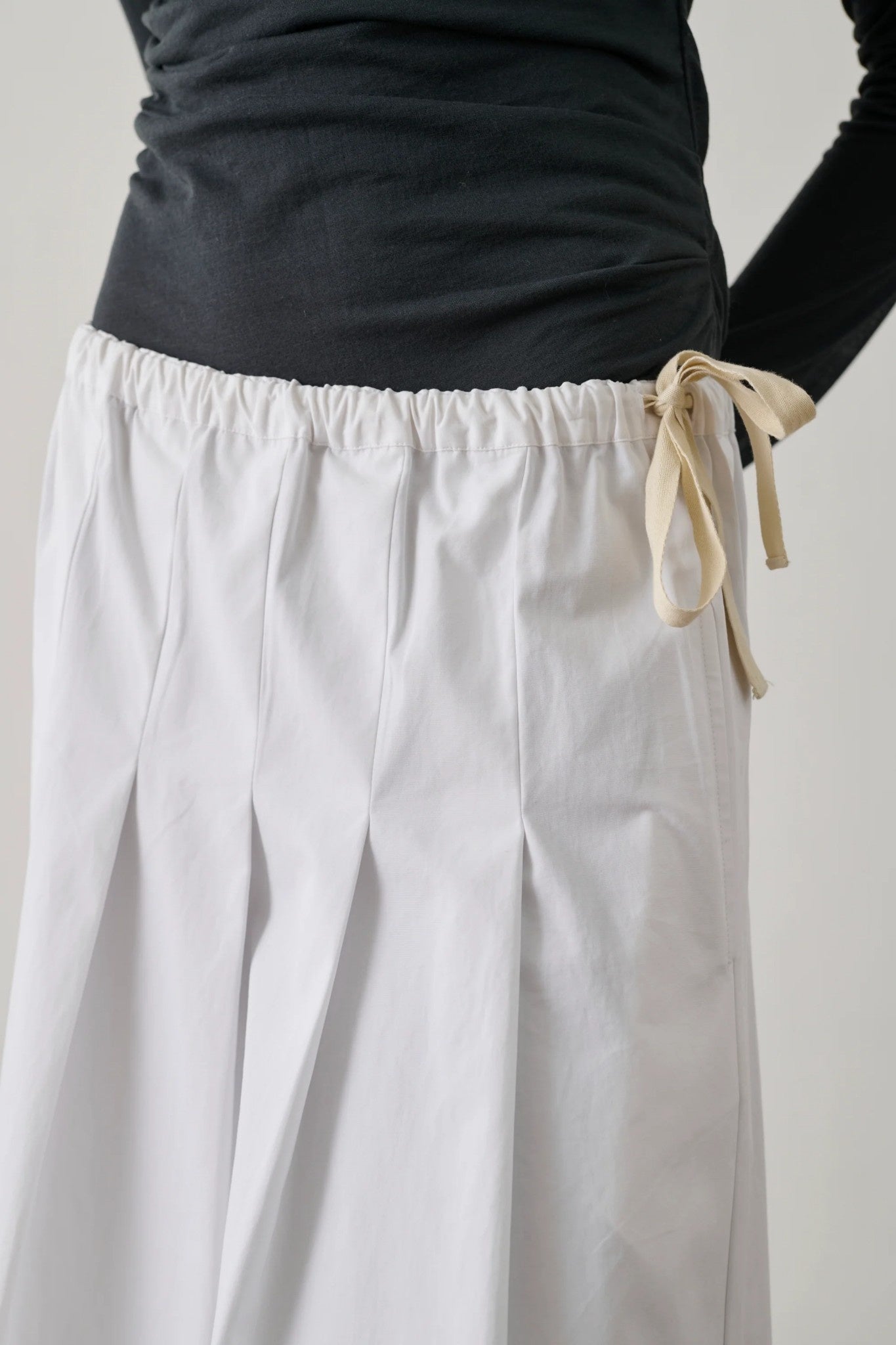tie detail on white skirt