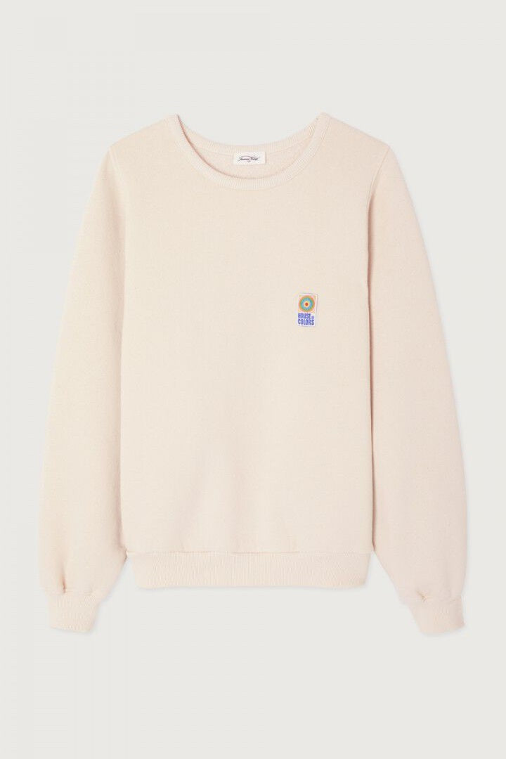 Beige sweater with a small logo on a light grey background