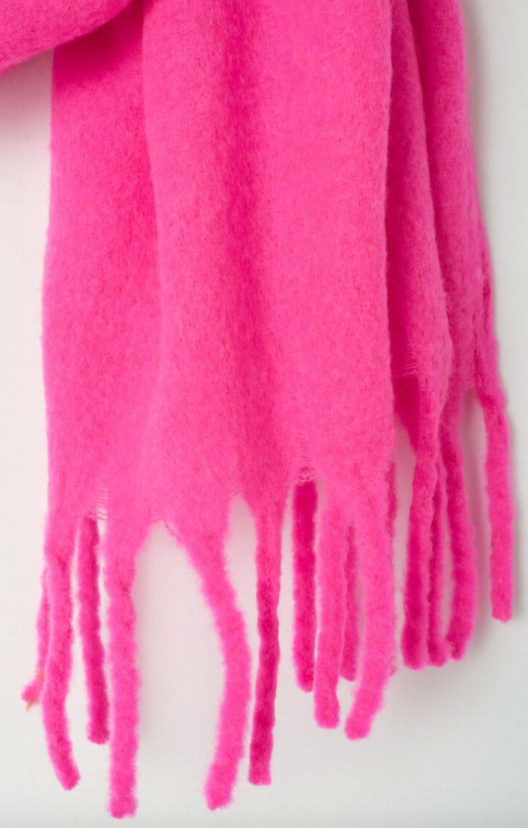 close up of neon pink scarf