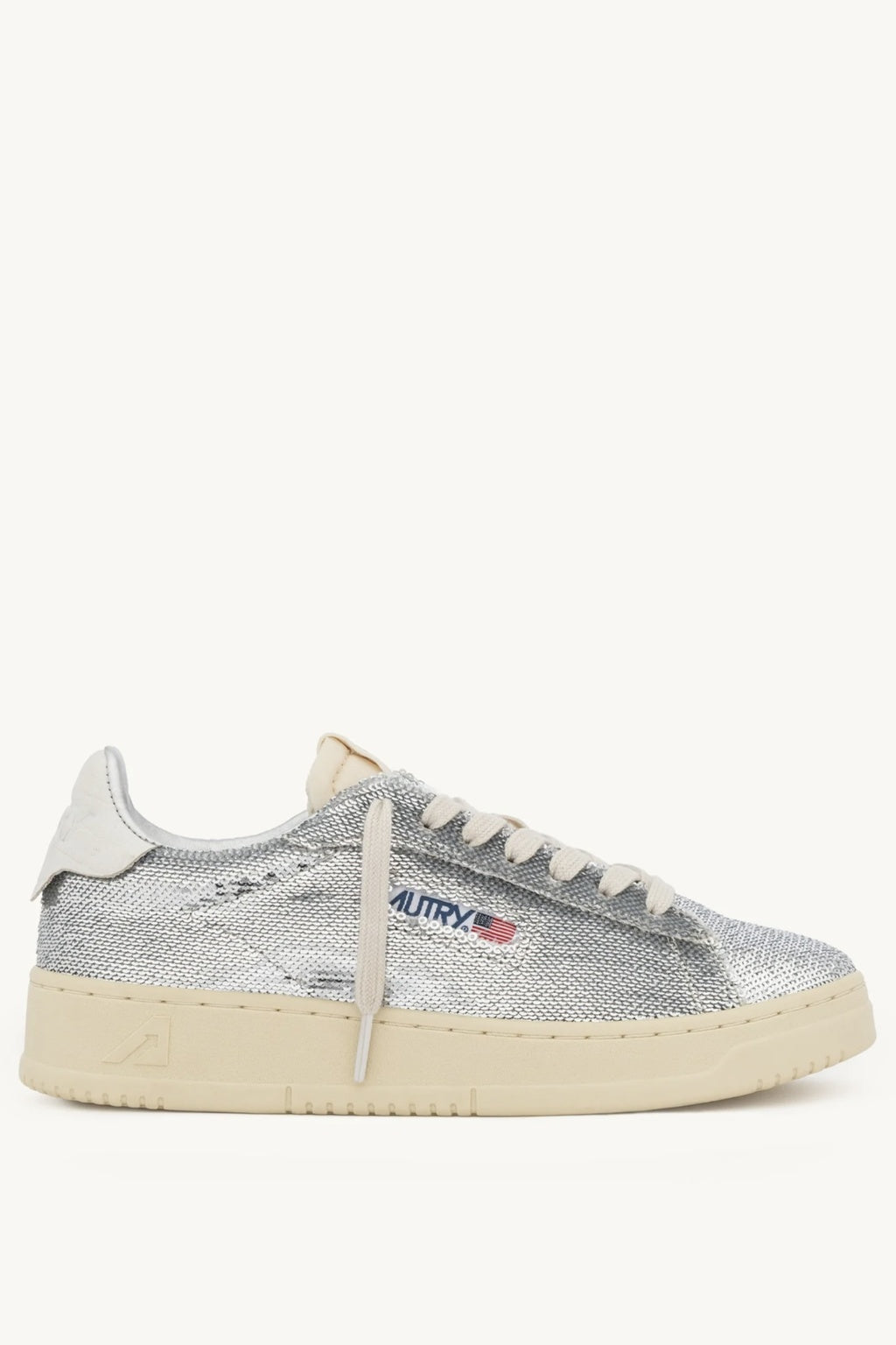 Silver Autry sneaker with a white sole on a white background