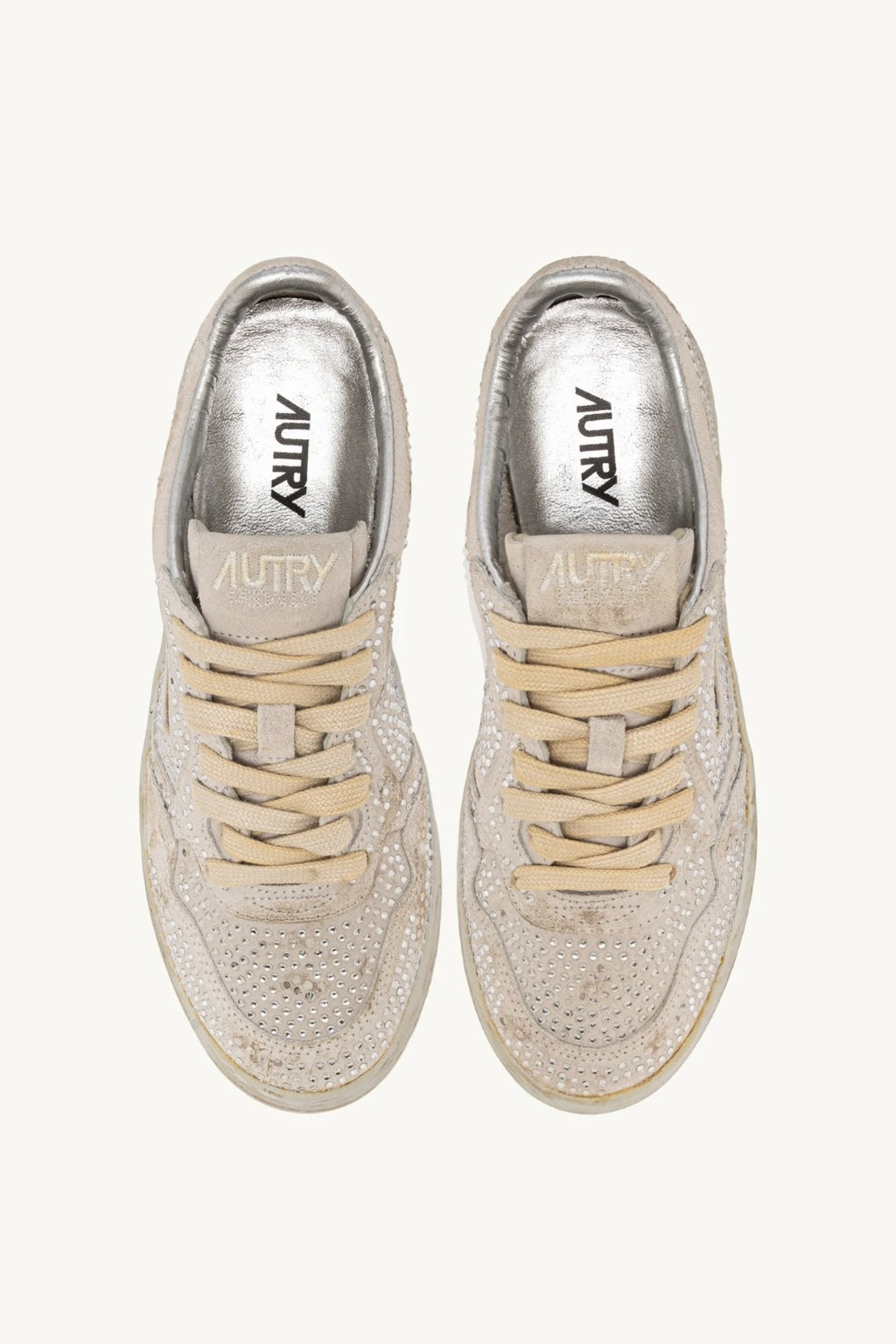 Pair of Autry white sneakers with visible brand name on a white background