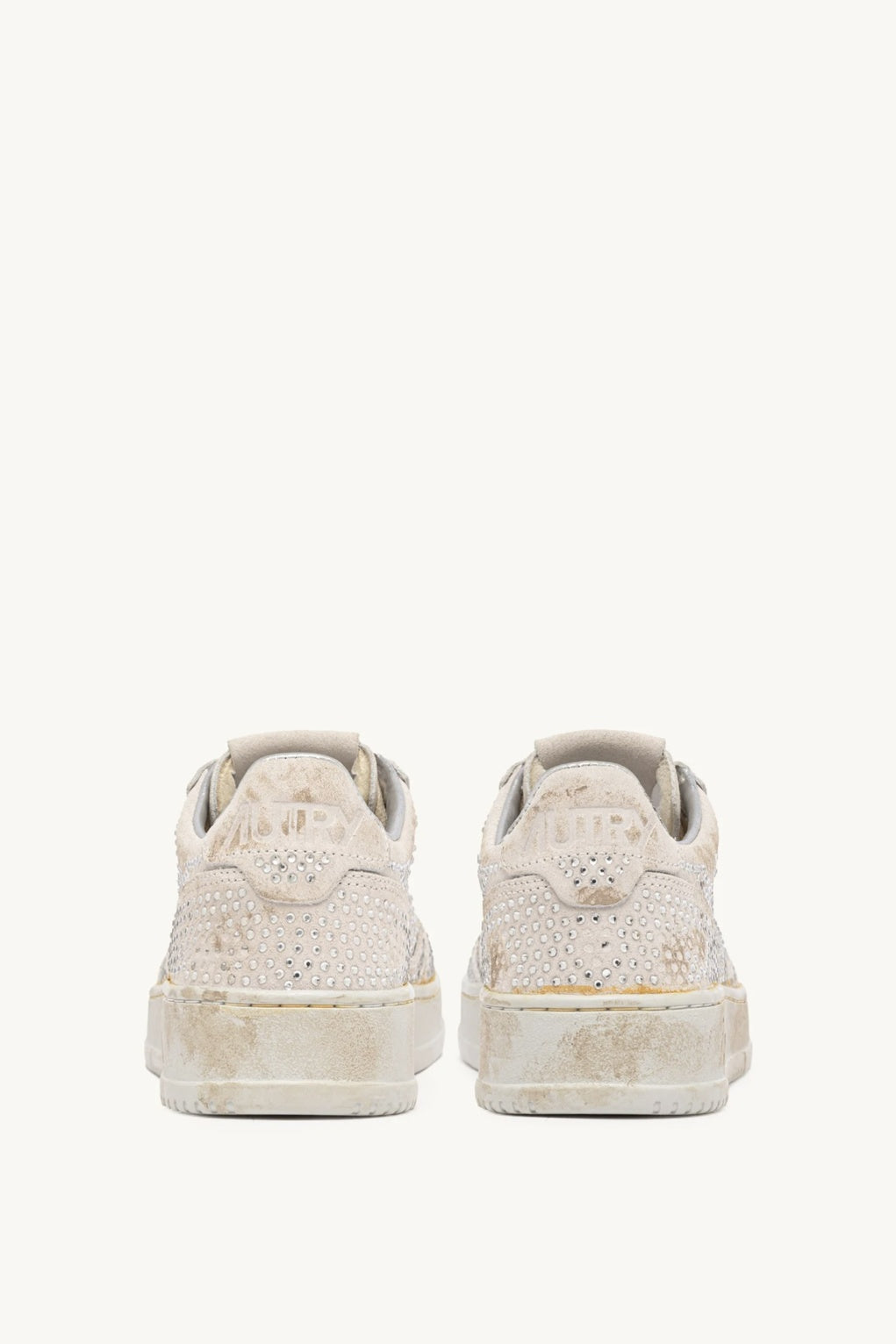 Pair of Autry white sneakers on a white background