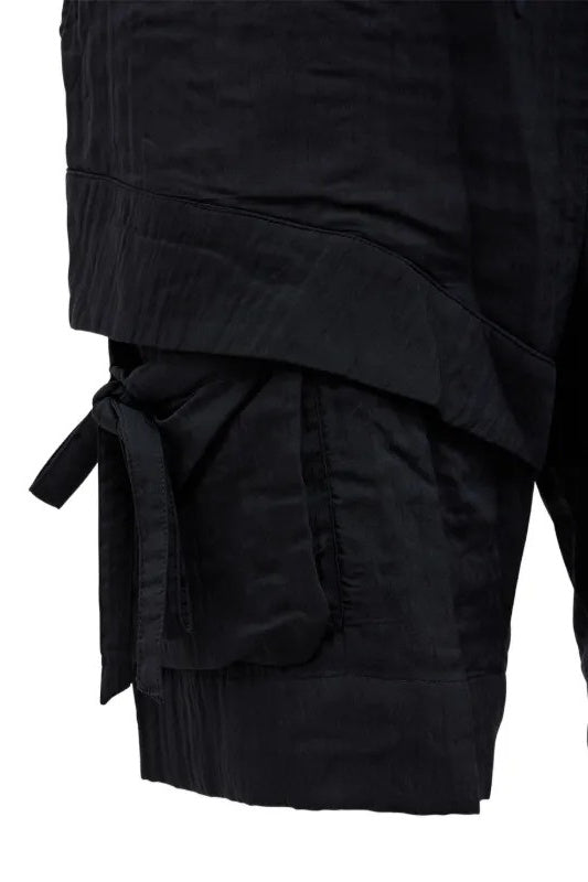 Black layered detail for shorts with a tie detail on a white background