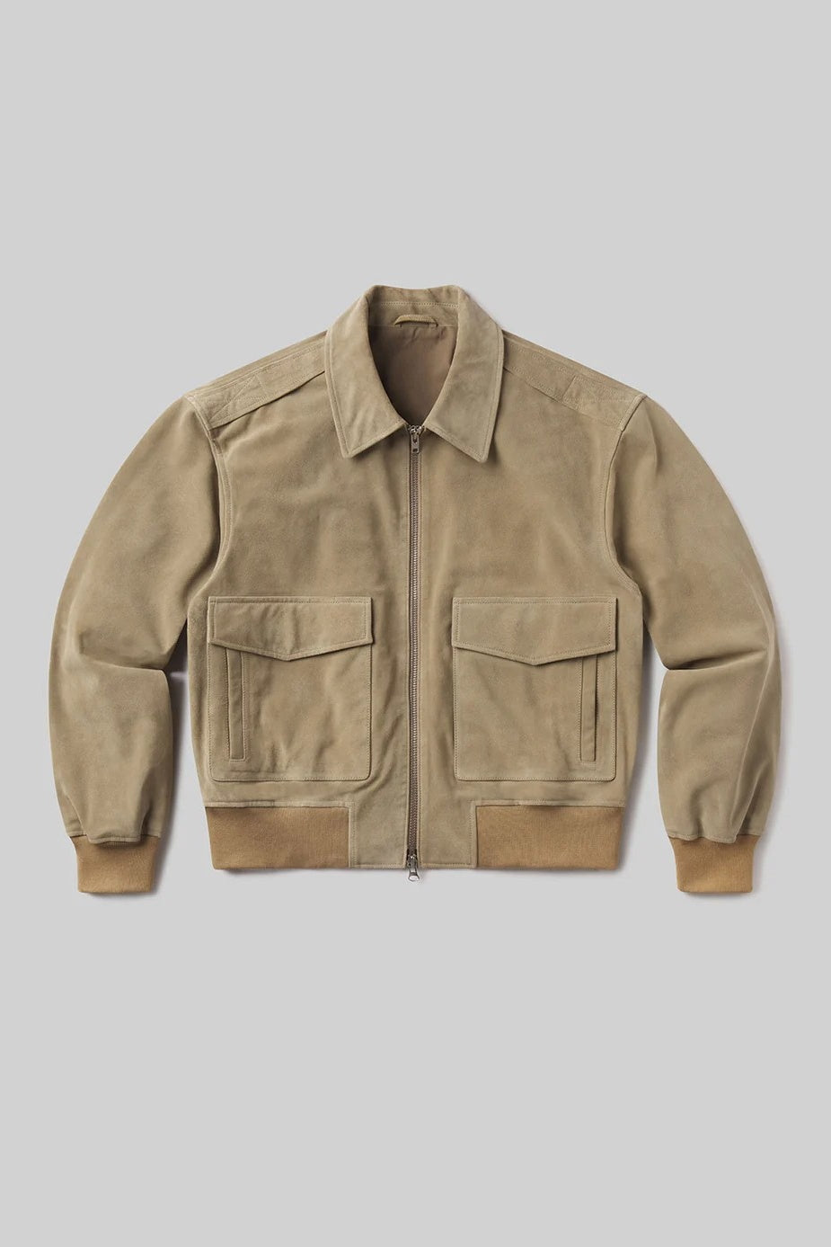 Beige jacket with two front pockets on a light gray background