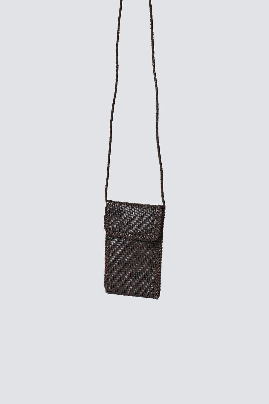 Dark brown  woven crossbody bag on a light gray background