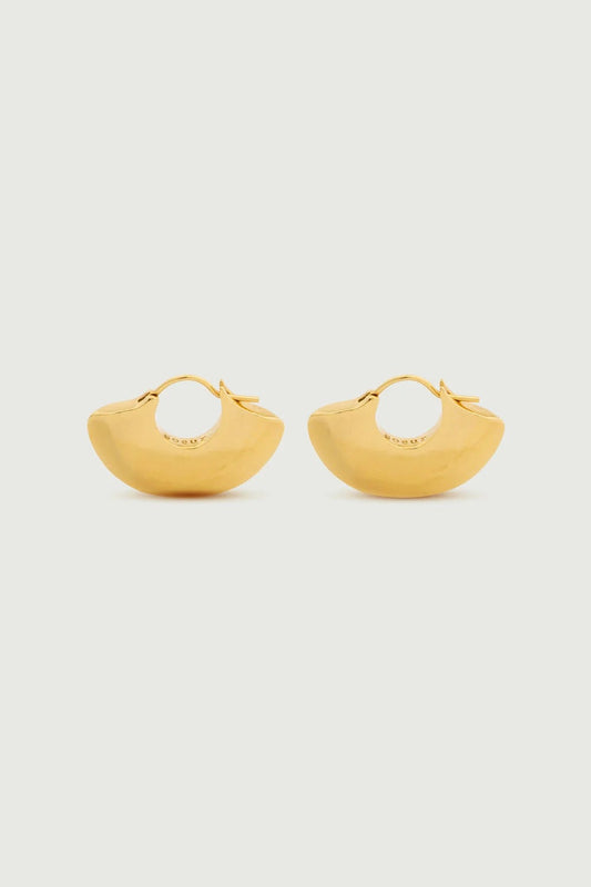 Pair of gold hoop earrings on a light gray background
