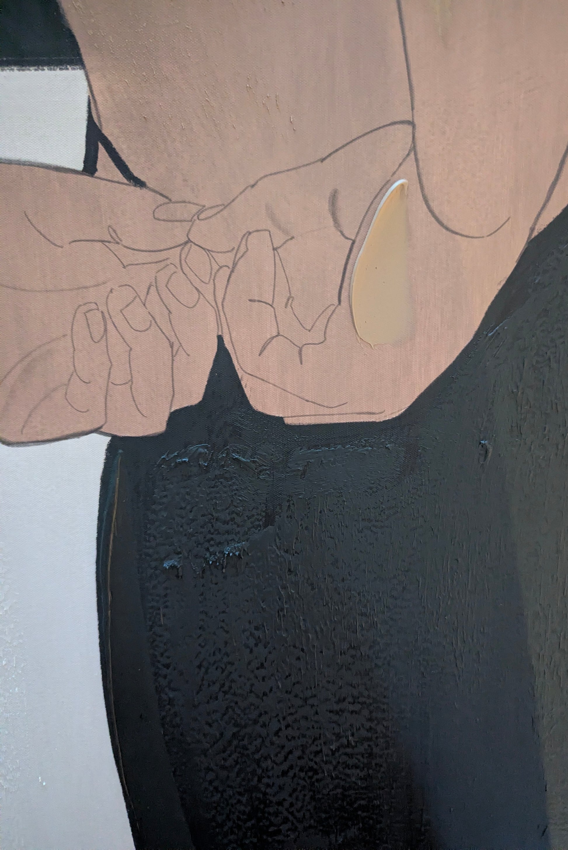 Close-up of a person wearing a black dress with a textured pattern.