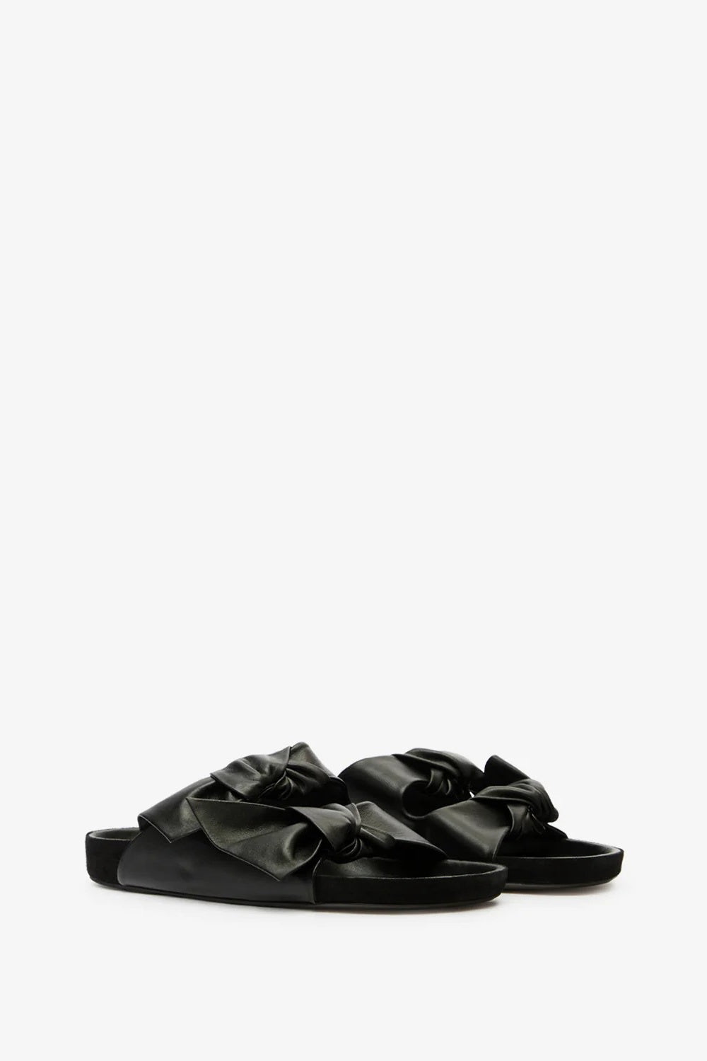 Black sandals with bow details on a white background