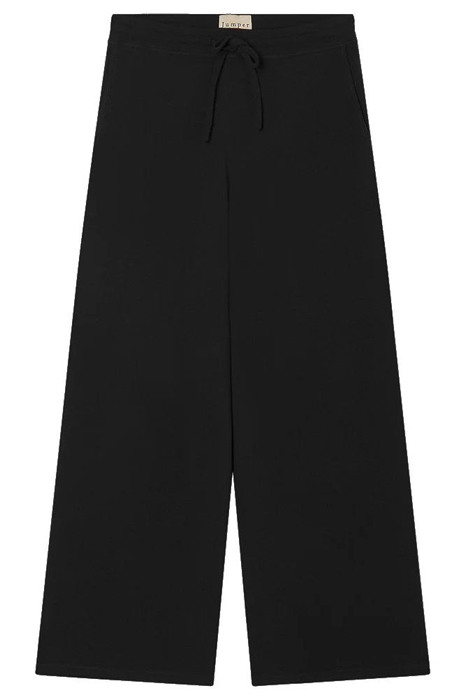 Black wide-leg joggers on a white background