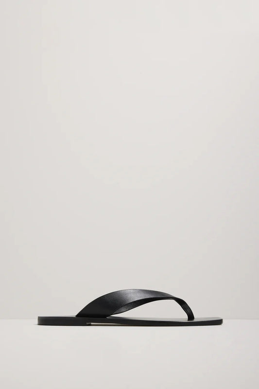 Black sandal on a light gray background