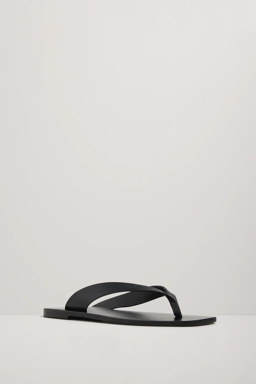Black sandal on a light gray background