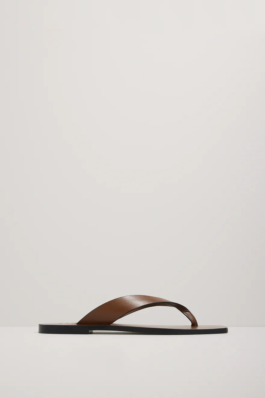 Brown sandal on a light gray background