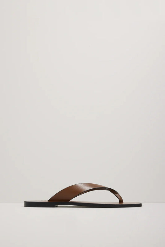 Brown sandal on a light gray background