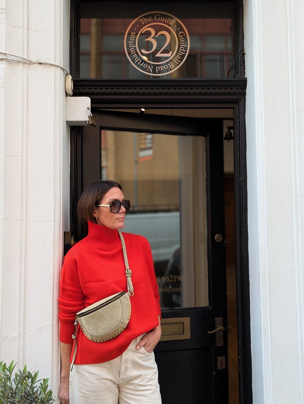 Zoie wear the Malo red funnel jumper by Vanessa Bruno alongside an Isabel Marant Camel bag