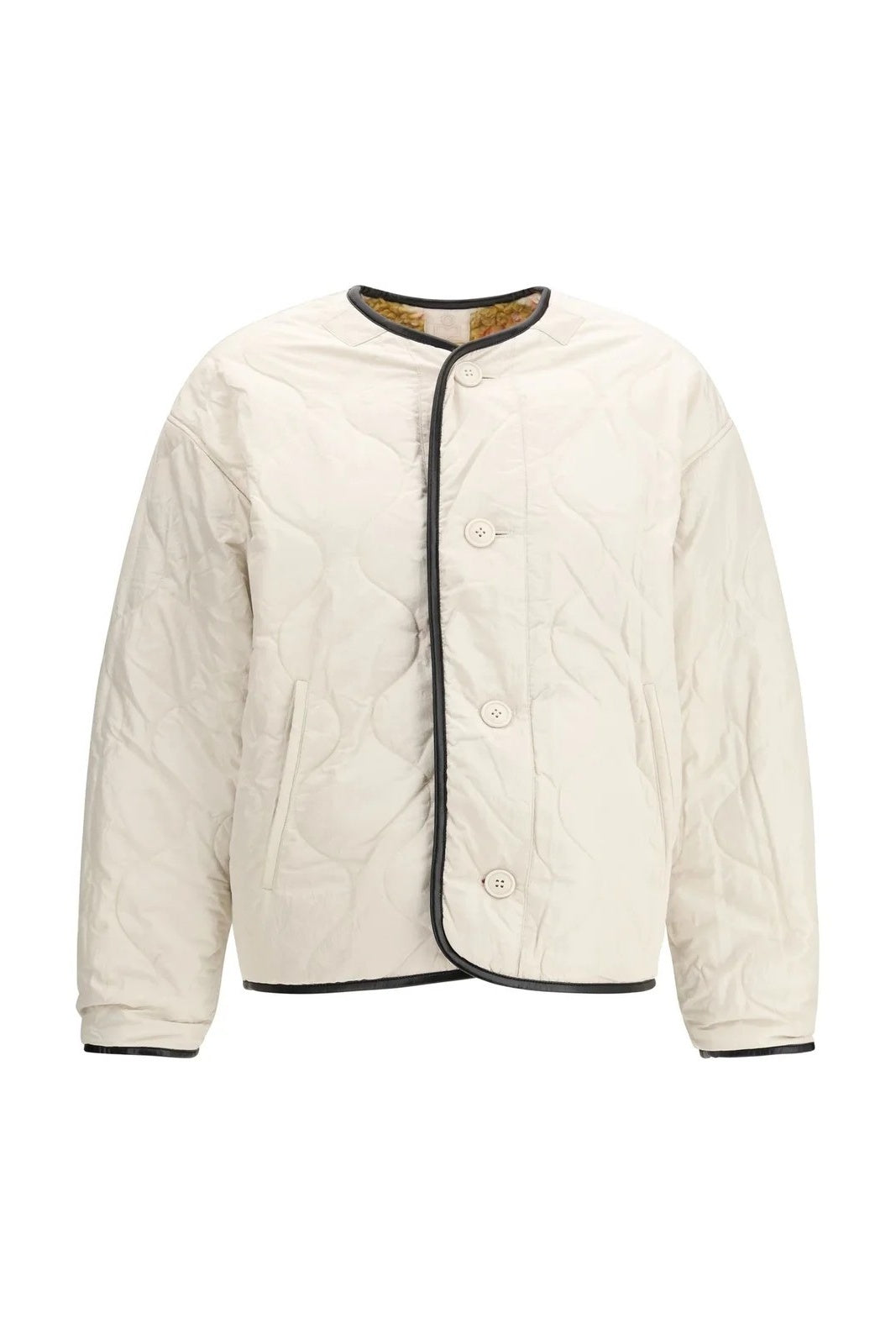 White quilted jacket reversable with black trim on a white background