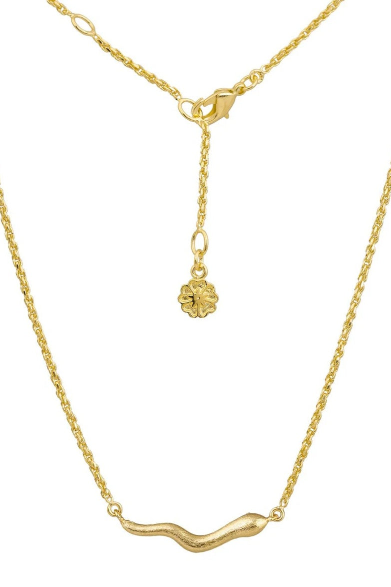 Gold necklace with a small  snake pendant on a white background
