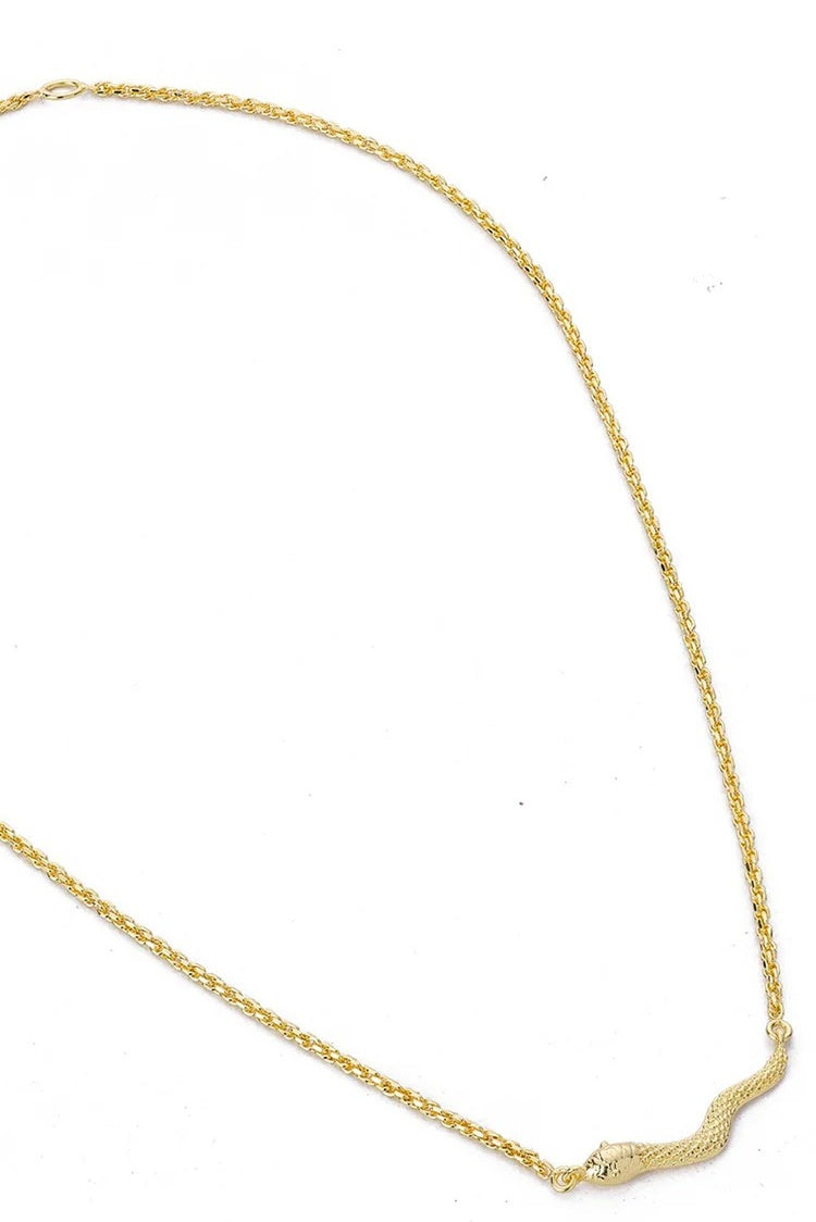 Gold chain necklace on a white background
