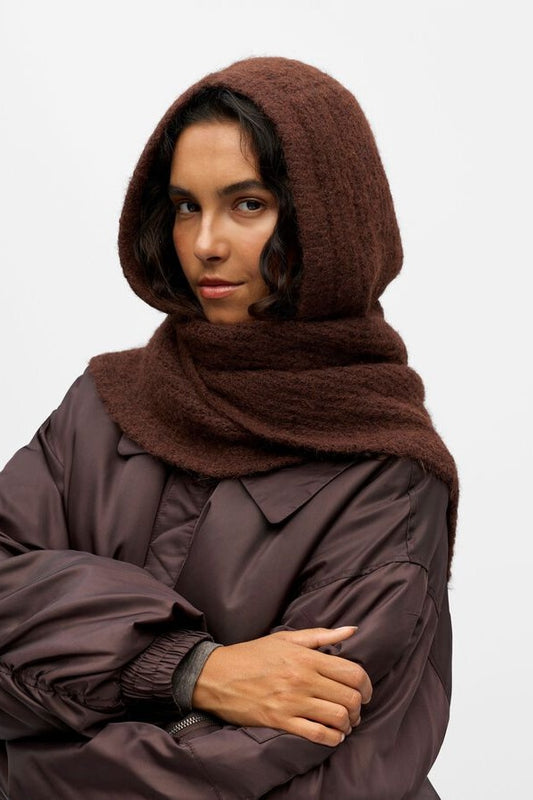Person wearing a brown hooded scarf on a white background