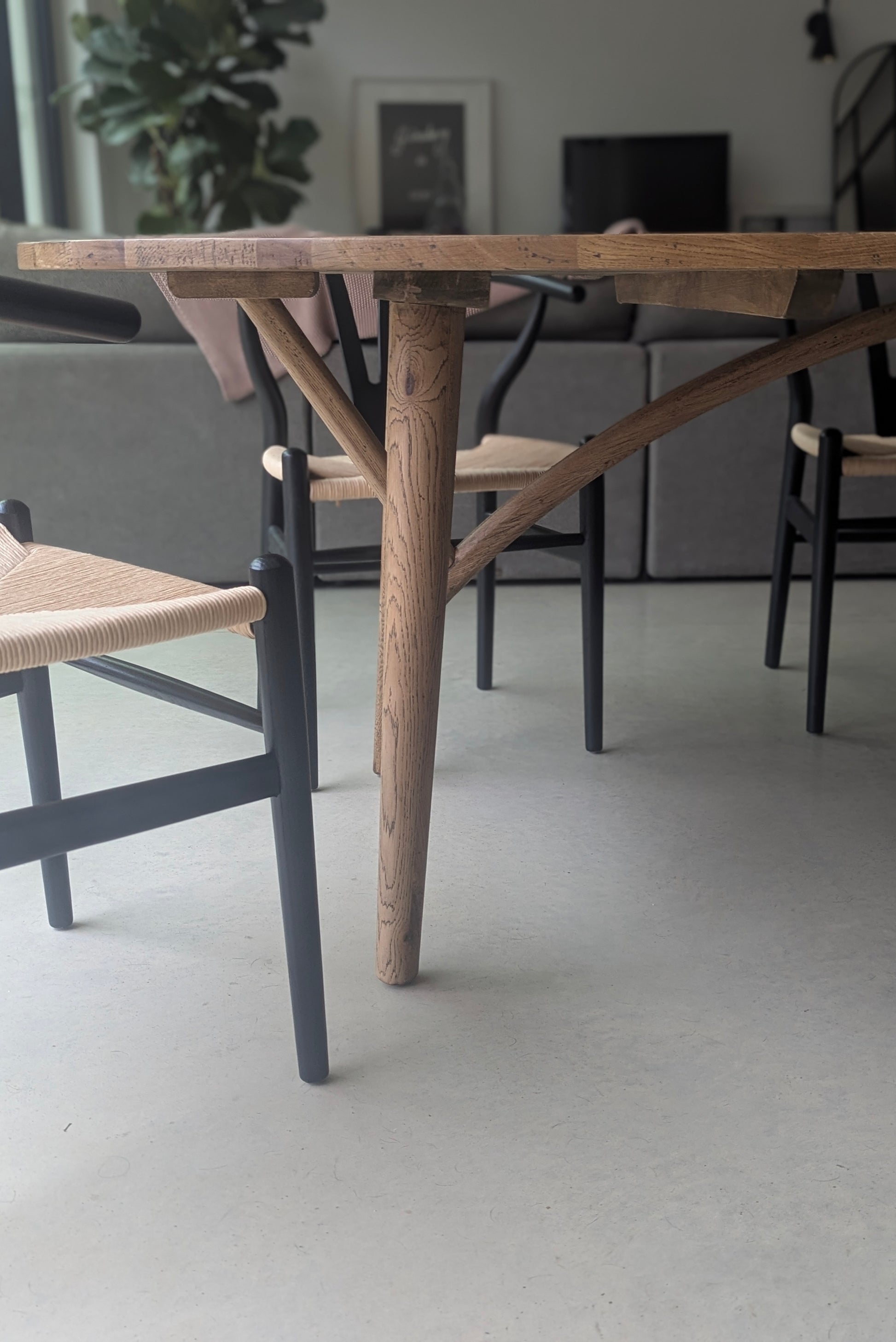 Wooden dining table with chairs in a room setting
