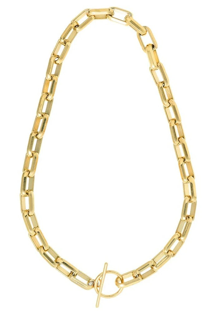 A gold-toned chain necklace with a t bar clasp, displayed on a clean white background.