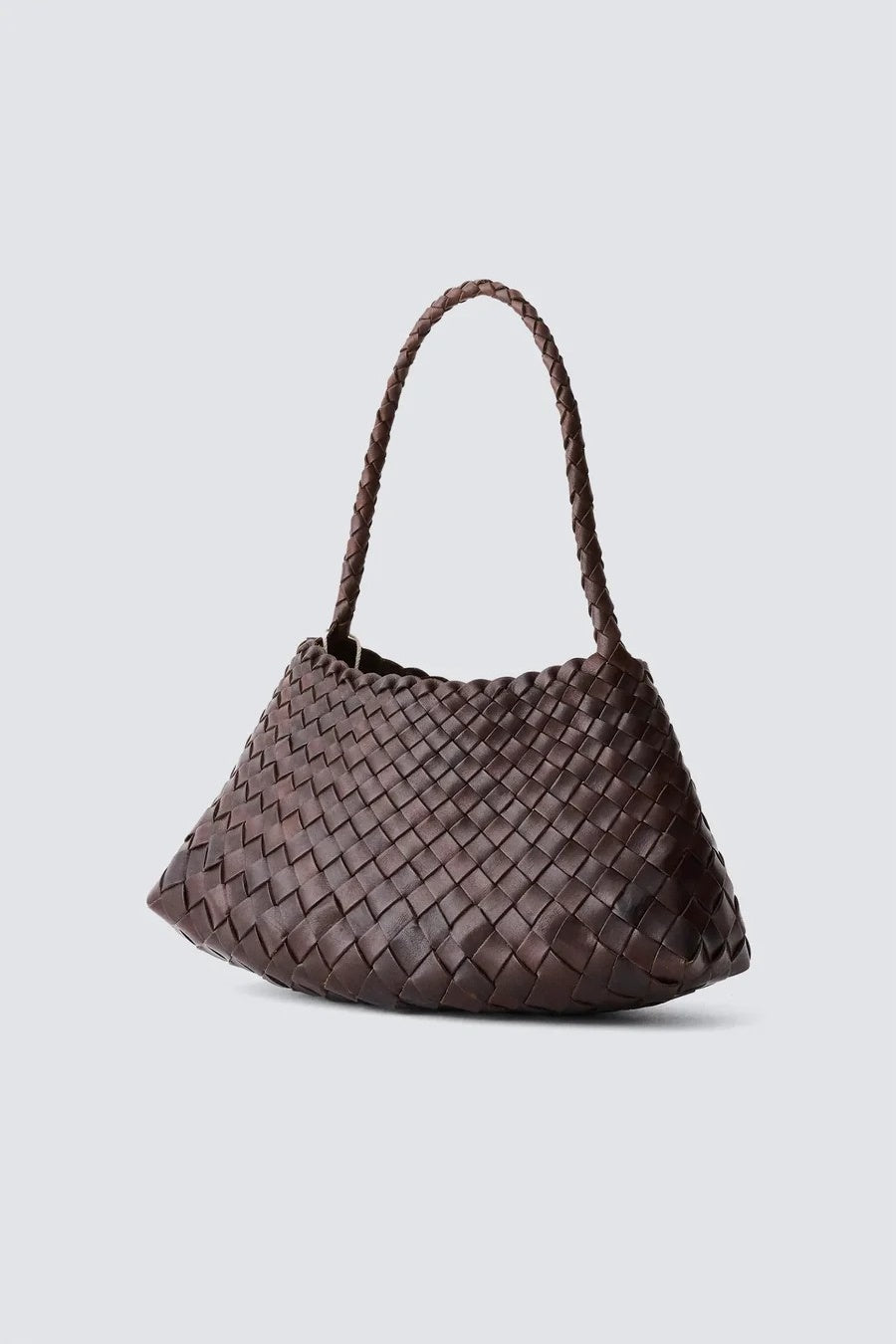 Woven handbag on a light gray background