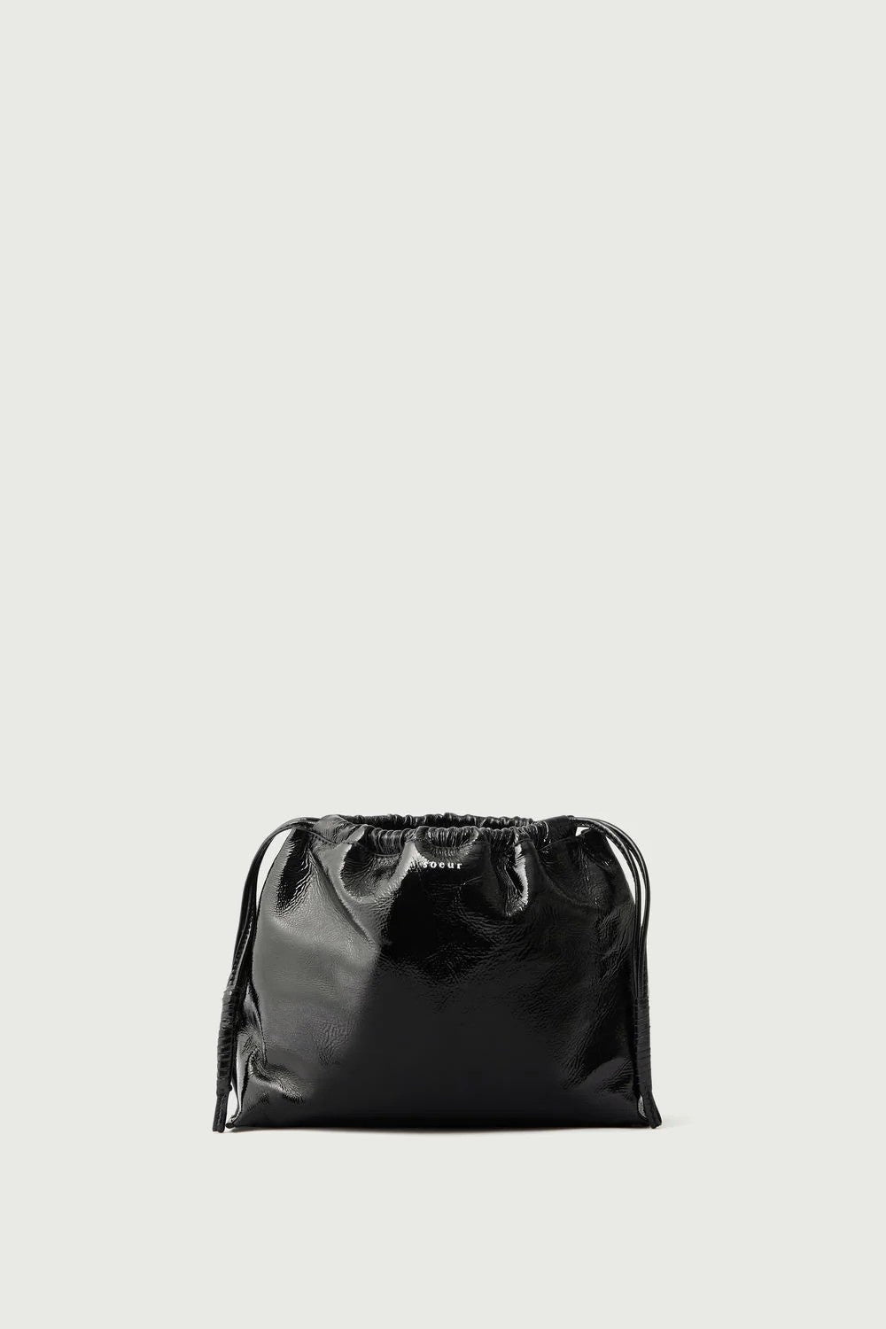 Black glossy pouch bag on a light gray background