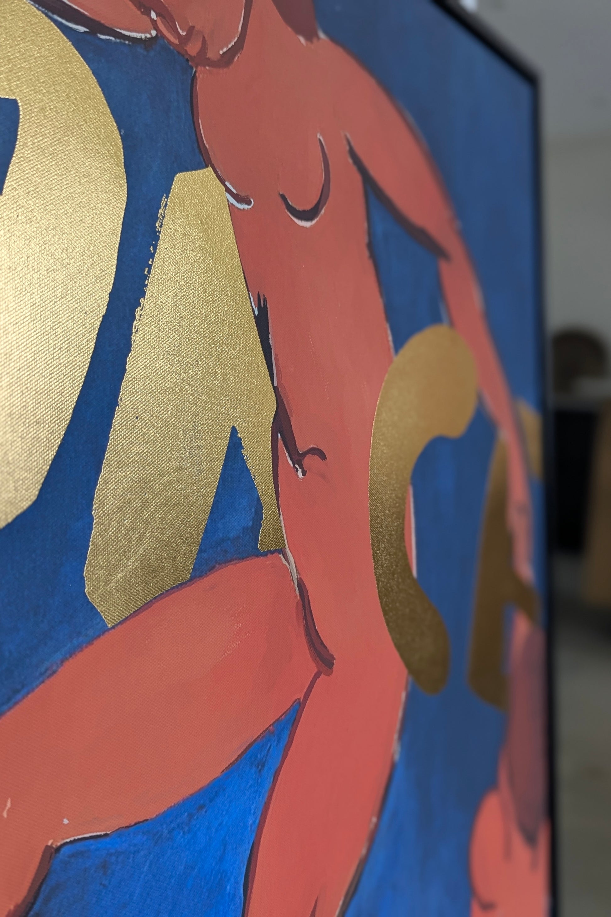 Partial view of a painting with abstract shapes and colors.