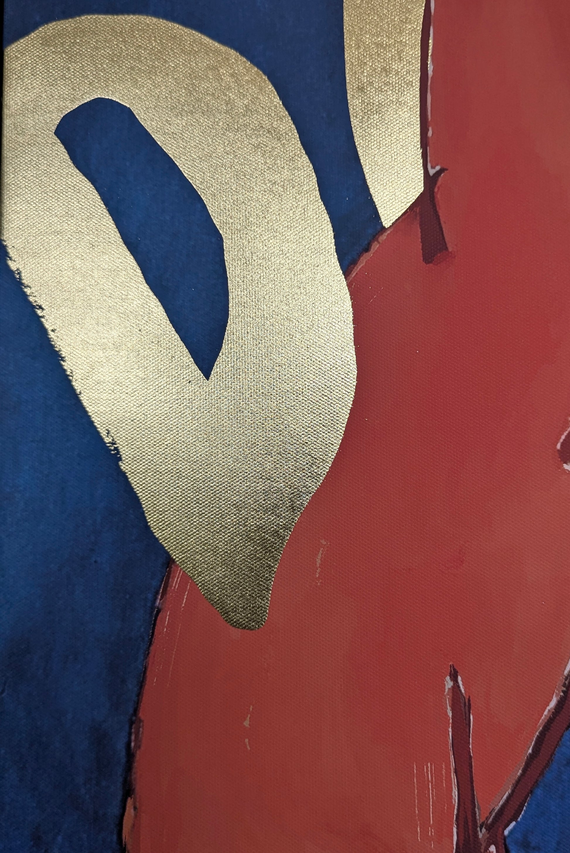 Abstract art piece with gold, blue, and red colors