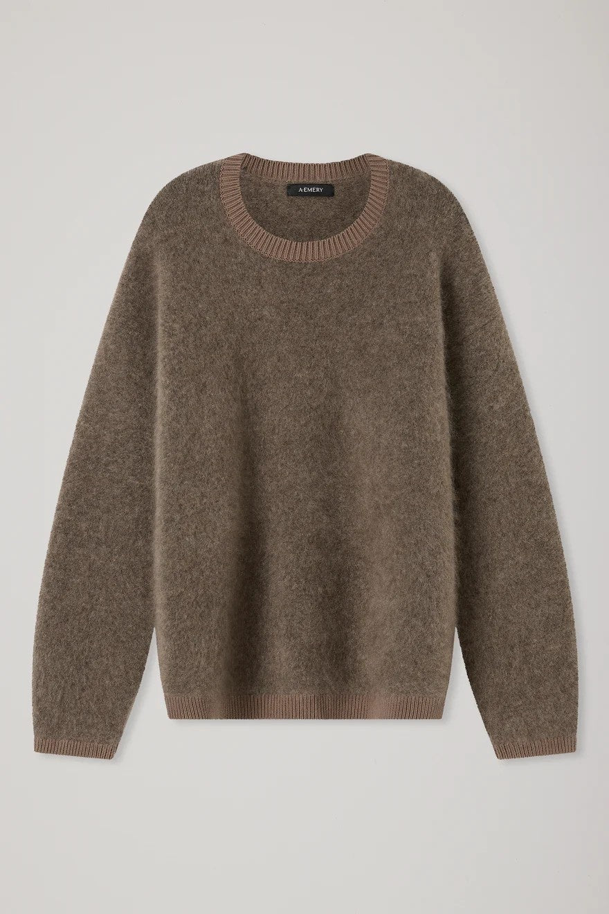 Brown sweater on a light gray background