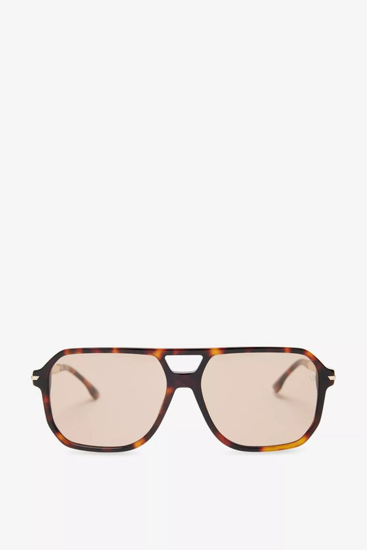 Sunglasses with a tortoiseshell frame on a white background