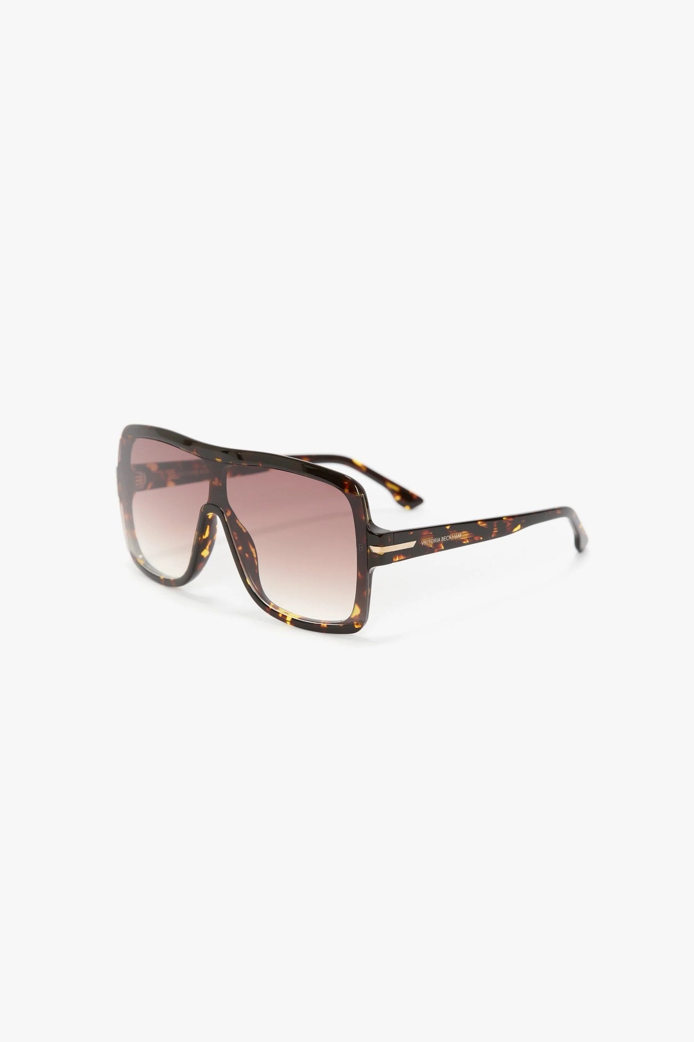 Sunglasses with tortoiseshell frame and gradient lenses on a white background