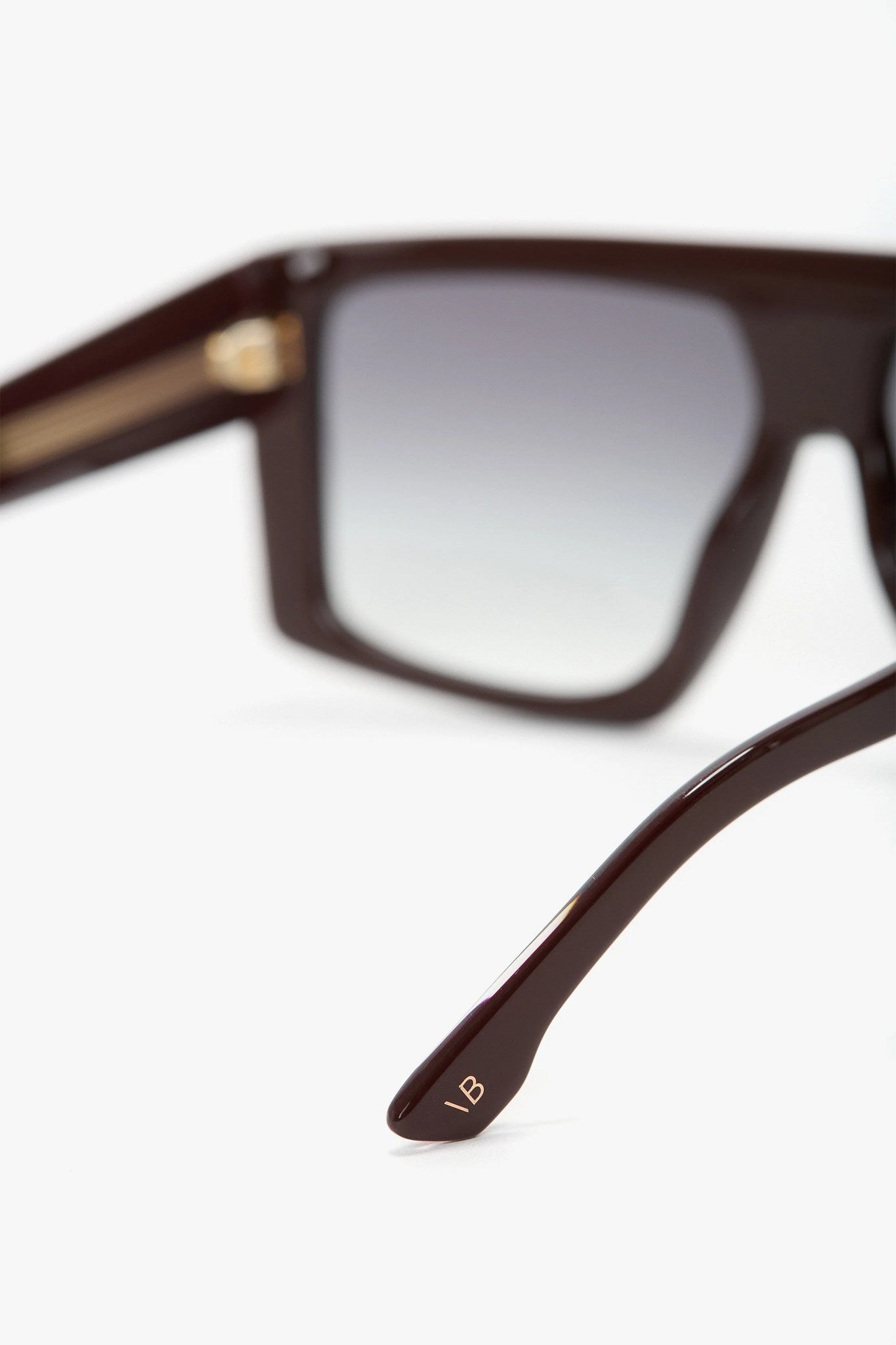 Close-up of a pair of sunglasses with a blurred background