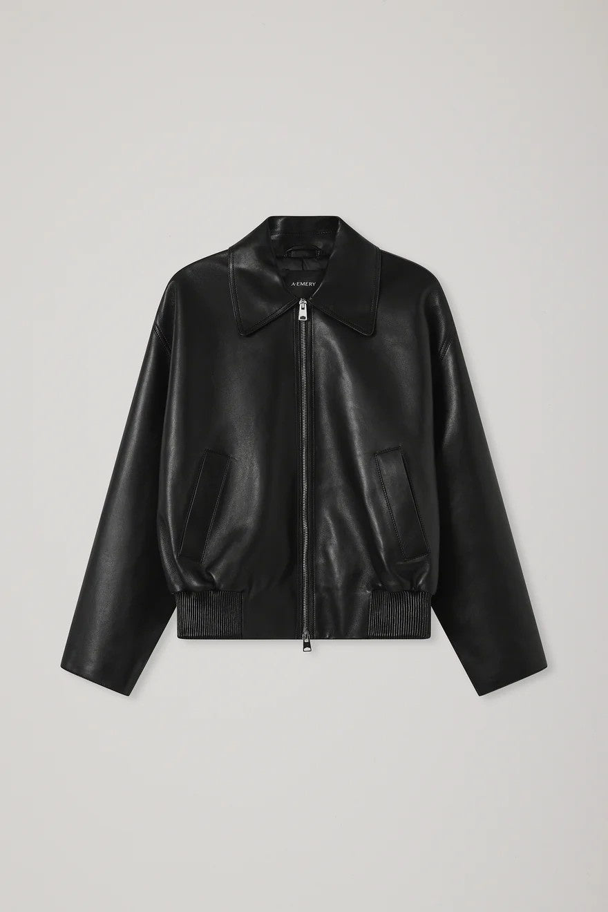 Black leather jacket on a light gray background