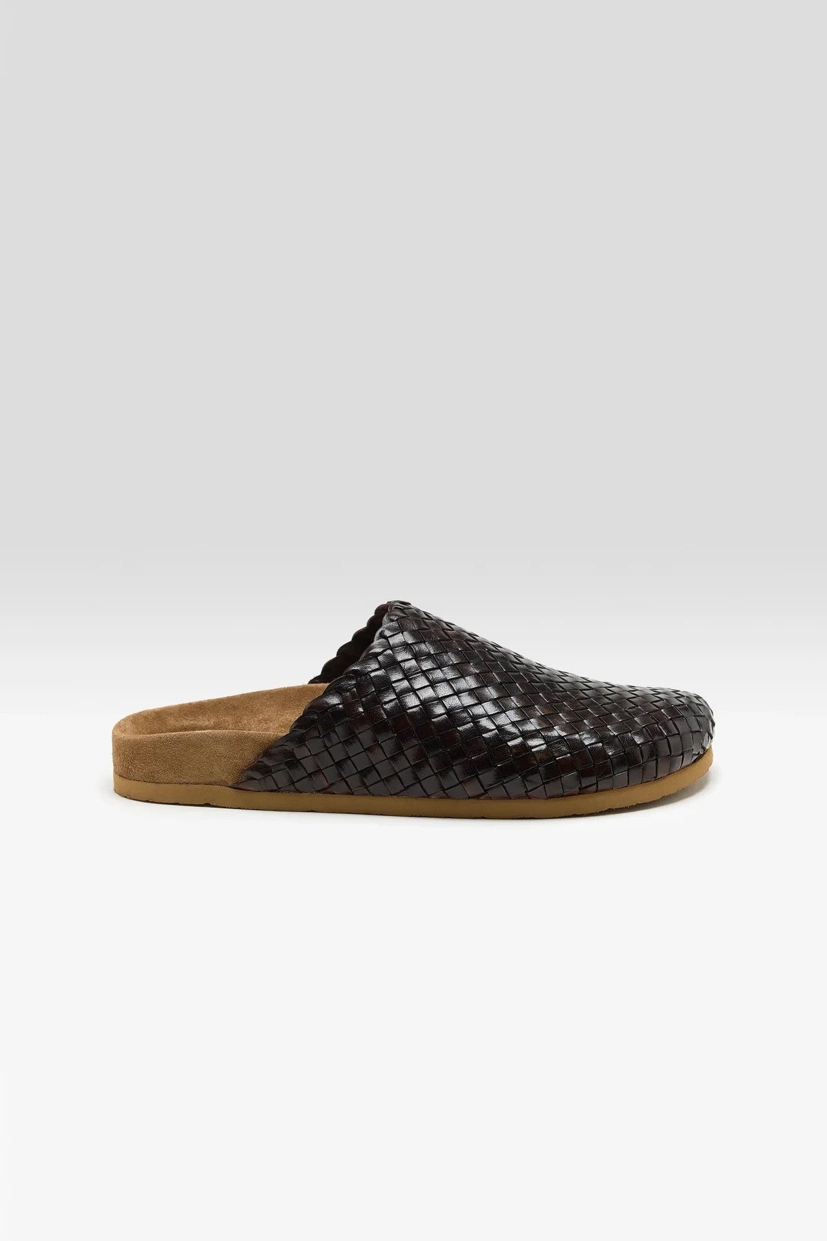 Brown woven mule on a white background