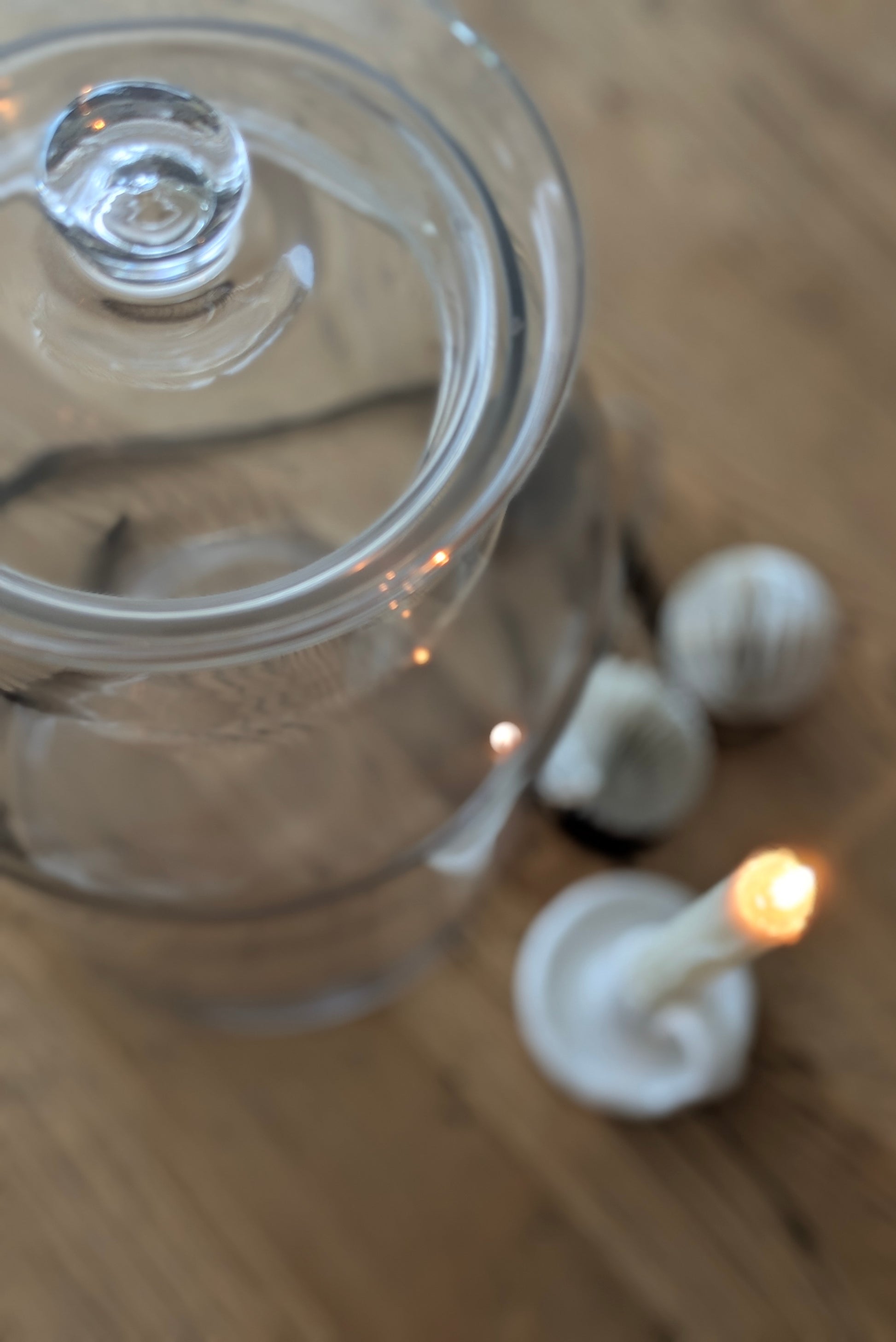 Clear glass jar with a lid on a wooden surface